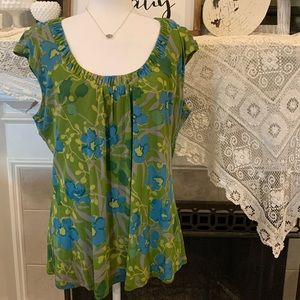 Cap sleeve top with unique detail at neck